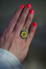 La Reina Cross Ring in Greens, Yellow, and Red