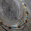 Glimmer of Gold Necklace with Garnet